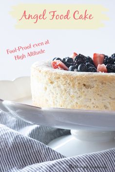 Angel food cake topped with fresh berries with text overlay. High Altitude Baking, Dairy Free Cake, Light Angel, Leftover Cake, Winter Desserts, Fool Proof, Angel Food Cake, Food Cake, High Altitude