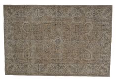 an antique rug with many different patterns and colors on the carpet, including greys