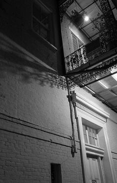 a black and white photo of a building at night