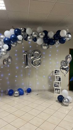 balloons and streamers in the shape of letters are on display at an office party