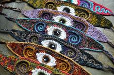 several crocheted items are laying on top of each other in the shape of an eye