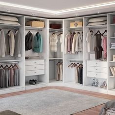 an organized walk in closet with lots of clothes