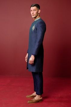 Navy blue sherwani highlighted with pintucked base and zari embroidered floral motifs. Comes with inner kurta and pant. - Aza Fashions Blue Bandhgala With Naqshi For Formal Occasions, Blue Straight Kurta Bandhgala For Ceremonial Occasions, Blue Ceremonial Straight Kurta Bandhgala, Formal Blue Sherwani With Naqshi Detailing, Formal Blue Sherwani With Naqshi, Blue Bandhgala For Ceremonial Occasions, Blue Bandhgala With Naqshi Traditional Drape, Blue Traditional Wear With Dabka For Groom, Blue Sherwani With Naqshi For Festive Occasions