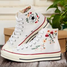 White Wedding Converse Shoes, Bridal Flowers Embroidered Converse High Tops 1970s, Rose Flower Embroidered Sneakers for Bride, Personalized Bridal Shóe 💚 Immerse yourself in the intricate craftsmanship as we lovingly hand embroider rustic flowers onto your chosen Converse pair 💚 🌿 The listed price encompasses both the Converse Shoes and the showcased Embroidery Designs. 1. MANUFACTURING PROCEDURE 🌿 Upon receiving your order, we initiate the shoe preparation process. If your chosen shoes are Wedding Converse Shoes, Embroidered Converse High Tops, Sneakers For Bride, Embroidery Sneakers, Converse Embroidery, Converse Chuck 70s, Strawberry Embroidery, Converse Wedding Shoes, Bride Personalized