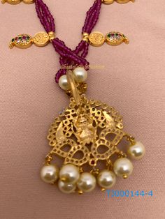 Pink Beads Goddess Lakshmi Detachable Pendent NecklaceColor : GoldenSize : Necklace Length : Approx 9 InchesStones : CZ Pearls Pink Beads