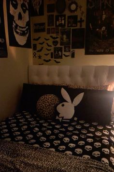 a bed with a black and white comforter on top of it