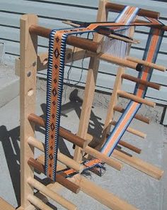 a wooden structure with multiple wires attached to it