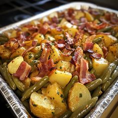 a pan filled with potatoes and green beans covered in bacon