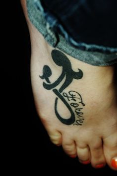 a person with a tattoo on their foot