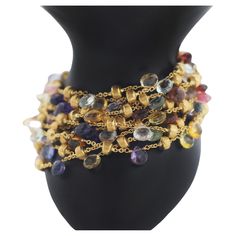 MARCO BICEGO Paradise Collection Multicolor Gemstones 10 Strand Bracelet with mixed semi-precious colored stones 18k Yellow Gold Length: 7.25" in length Weight: approx. 53.8 grams Width: approx. 42mm Stamped Hallmarks: Marco Bicego 750 In great looking condition wear consistent with time and some use See images please No original box or papers Luxury Multicolor Multi-stone Gemstones, Luxury Multicolor Gemstones With Accents, Luxury Multicolor Gemstones, Yellow Gold Multi-stone Fusion Gemstones, Fusion Style Multi-stone Yellow Gold Gemstones, Gold Multi-stone Fusion Gemstones, Luxury Multicolor Briolette Jewelry, Luxury Multicolor Natural Gemstones, Fine Jewelry With Multicolor Briolette Gemstones