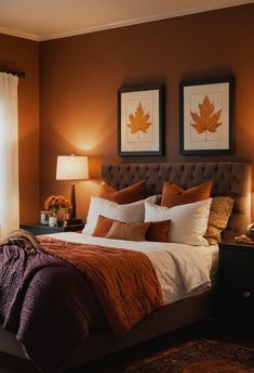 a bed sitting in a bedroom next to two lamps on either side of a window