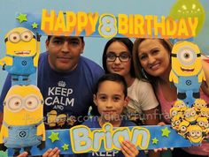 a group of people holding up a birthday card