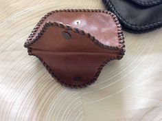 "This double coin purse is made with soft cowhide leather, a pocket on both sides with snaps, and even a pocket between the two . Hand laced and stitched to make it stronger, secured with a rivet on each side for strength, will make a nice gift. About 5-1/4\" wide x 3-1/2\" height closed. This coin purse will hold quite a few coins, bills, and one side will easily hold 13 or more credit cards. Terrific gift. Holds lots of money. Shipping insurance is included with postage. If you order multiple Money Purse, Fall Rings, Tiny Rings, Leather Ring, Leather Coin Purse, Confirmation Gifts, Coin Bag, Lots Of Money, Rare Coins