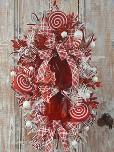 a red and white christmas wreath with candy canes