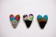 three pieces of crochet are arranged in the shape of an ice cream cone