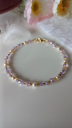 Sparkling bracelet with river micropearls, gold Toho pearls and lilac Swarovski. Adjustable! Extremely long-lasting, hypoallergenic 24k gold-plated components. Perfect to combine with a lilac dress for a special event! Would you like to have the necklace and earrings too? Send me a message! He knows Elegant Lavender Crystal Bracelet With Round Beads, Elegant Purple Crystal Bracelet With Spacer Beads, Elegant Crystal Bracelet With Gold Beads, Elegant Gold Crystal Bracelet With Spacer Beads, Gold Pearl Crystal Bracelet With Round Beads, Elegant Beaded Lavender Bracelets, Elegant Lavender Beaded Bracelets, Elegant Lavender Beaded Bracelet, Delicate Gold Beaded Crystal Bracelet