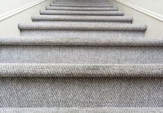 the carpeted stairs are lined up in rows