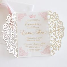 a wedding card with a tiara on it and pink ribbon tied to the front