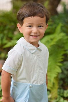 This classic short set for little boys comes in 100% cotton with French seams for comfort. The shirt has elegant tucks down the front with piping accents on the sleeves and collar. Fabric-covered buttons close the back opening and attach to a lined crystal blue short. This set coordinates with the crystal blue dresses in our collection for weddings, family photos or any other special occasion your little one is going to. Outfit Classic, Hand Smock, Beach Portraits, Light Blue Dresses, French Seam, Fabric Covered Button, Boy Blue, Short Set, Fine Fabric