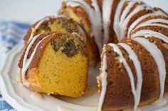 a bundt cake with white icing on a plate