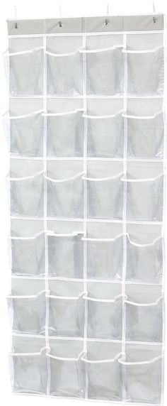 a white wall hanging organizer filled with lots of storage bins and divider pockets