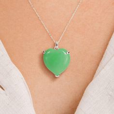 A stunning personalised sterling silver natural Jade necklace that is the perfect gift for women and girls. Not to be found anywhere on the high street, our beautiful natural Jade charm necklace is crafted from the finest sterling silver. This lovely Jade pendant is perfect for any age, featuring a gorgeous heart-shaped natural Jadeite gemstone set in a lovely silver setting. Make your necklace even more special by choosing your chain length and adding a personalised sterling silver disc charm. Sterling Silver Heart Necklace With Polished Finish As Gift, Green Sterling Silver Jewelry For Valentine's Day, Valentine's Day Green Sterling Silver Jewelry, Sterling Silver Jewelry With Heart Charm In Green, Sterling Silver Jewelry With Heart Charm For May Birthstone, Silver Heart Cut Necklace For May Birthstone, Green Sterling Silver Charm Necklace, Sterling Silver Heart Charm Necklace In Fine Jewelry Style, Green Sterling Silver Necklace With Heart Charm