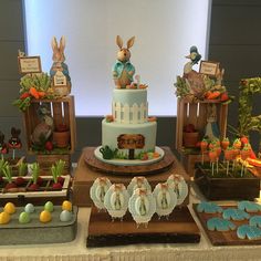 a table topped with lots of cakes and desserts