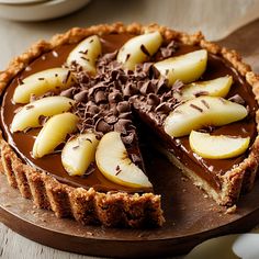 a chocolate pie with sliced apples on top