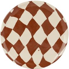 a brown and white checkered plate on a white background