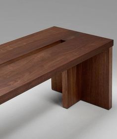 a wooden table with one section missing from the top