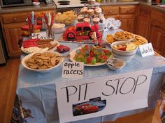 a table topped with lots of food and desserts