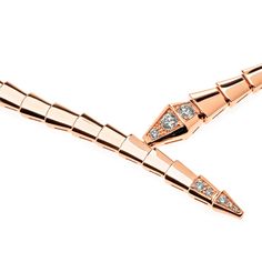 BVLGARI Serpenti Viper Necklace in Rose Gold Bulgari embodies the power of seduction and sensuality in this Serpenti Viper Necklace. Aesthetically pleasing and guaranteed to mesmerize its on-lookers, this glamorous piece convolutes around the neck, exemplifying the scales and beauty of the snake. Details 18k Rose Gold 0.41ct DiamondSize: Large (38 cm) Ref: 357864 Condition: Brand New *Comes with original box & authenticity card. Luxury Snake Shape Necklace For Formal Occasions, Luxury Formal Snake Shape Necklace, Elegant Snake Shape Necklace For Party, Luxury Rose Gold Necklace For Evening, Elegant Rose Gold Snake Chain Necklaces, Serpenti Viper Necklace, Power Of Seduction, Bvlgari Serpenti, Necklace Rose Gold