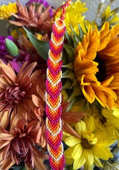 colorful flowers are arranged together in a vase