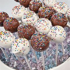 chocolate covered cake pops with sprinkles in a bowl