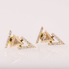 A pair of delicate, handmade stud earrings set with triangle diamonds and a detachable halo of small diamonds. Each earring is made of two parts, a triangle diamond stud and a detachable halo. Triangle Diamonds - Weight - 0.3ct (0.15ct in each) Color - G Clarity - SI Small Diamonds - Weight - 0.15cttw Color - G Clarity - SI ----------------------DIMENSIONS---------------------- Each side of the earring is 9mm wide and 14.5mm long. -----------------------CUSTOM ENGRAVING---------------------- Cus