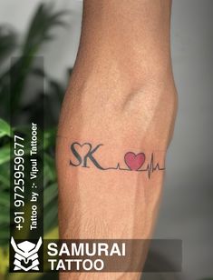 a man's arm with a tattoo on it and the words samurai tattoo written in black ink