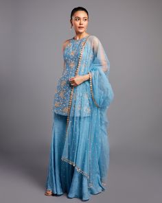 Glamorous glass beads embroidered raw silk kurta paired with sharara and net dupattaFrom Chamee and Palak 's Alora collectionDELIVERY TIMEPlease allow 8-12 weeks for your outfit to arriveFABRIC DETAILSGeorgette, raw silk, and netProfessional cleaning only Luxury Blue Sharara For Festive Occasions, Luxury Blue Sharara With Dupatta, Luxury Blue Sharara For Spring, Luxury Blue Sharara For Festivals, Luxury Blue Silk Sharara, Luxury Blue Tissue Silk Sharara, Luxury Turquoise Sharara With Dupatta, Luxury Blue Bohemian Sharara, Luxury Light Blue Fitted Sharara