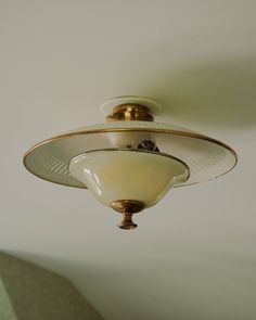 a ceiling light in a room with white walls