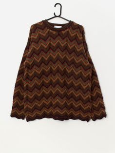 Rare 90s vintage Laura Ashley oversize sweater in autumn brown. This rare and beautiful 90s sweater features a zig zag pattern in autumnal colours, a crew neck, long sleeves and has an oversized fit. Made in Scotland from a mid-weight pure new wool.  Our recommended size: Medium to large Label says: Large Condition: Very good  Material: 100% pure new wool  Measurements in inches: Pit to pit: 23 Shoulders: 24.5 Front length: 28.5 Back length: 29 Sleeve length: 22 Hem (unstretched): 22 Hem (stretc Autumnal Colours, Vintage Laura Ashley, 90s Sweater, Oversize Sweater, Zig Zag Pattern, Pullover Sweater Women, Laura Ashley, Sweaters Oversized, 90s Vintage