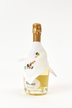 a bottle of wine with a white label on it and a paper napkin wrapped around the top