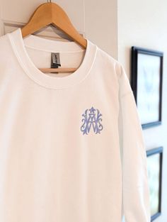 Our monogram sweatshirt makes a great, cozy gift for mom or as a comfy gift for brides and bridesmaids. Our sweatshirts feature an embroidered custom monogram in 3 sweatshirt colors ranging from sizes small to 5XL (Sand only available up to 3XL). Customize this comfy gift with the monogram and thread color of your choice.  ✨ Sample  - White Sweatshirt - Willa Monogram - Hydrangea Thread Color (Not on the thread chart; For this thread option just add to personalization box) ✨ Please Note: All our sweatshirts are embroidered not printed! ✨ Available in 3 colors - White, Sand & Black ✨ Heavy Blend Fleece - 50% Cotton/50%Polyester ✨ Available in sizes S-5XL (Sand only Available to 3XL). See Photos for Size Charts. ✨ Do you need your order sooner than our current production time? Click the link Monogrammed Sweatshirt, Monogram Sweatshirt, Wedding Wonderland, Embroidered Initials, Cozy Gift, Sweatshirt For Women, Custom Sweatshirts, Monogram Gifts, List Style