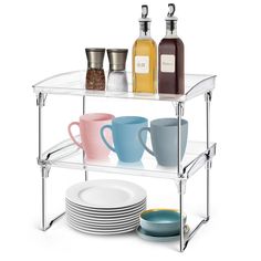 three tiered shelf with cups and plates on it