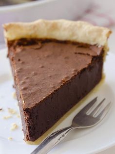 a piece of chocolate fudge pie on a plate