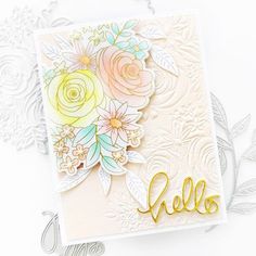 a card with flowers and the word hello written in gold foil on top of it