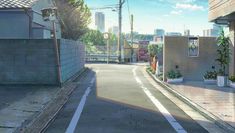 an empty street with buildings in the background