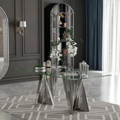 a glass table sitting in front of a mirror on top of a floor next to a doorway