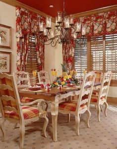 the dining room table is set with many chairs