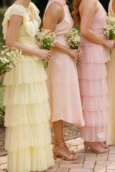 Mismatched pink and yellow bridesmaid dresses Pastel Yellow Bridesmaid Dresses, Colorful Garden Party, Pastel Garden Wedding, Pale Yellow Weddings, Pink Yellow Weddings, Pale Pink Bridesmaids, Patterned Bridesmaid, Pastel Bridesmaids, Patterned Bridesmaid Dresses