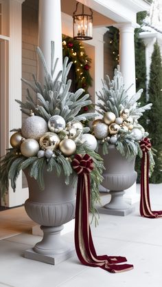 christmas decorations in urns on the front porch