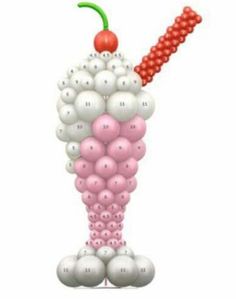 an image of a bunch of balloons in the shape of a person with a cherry on top